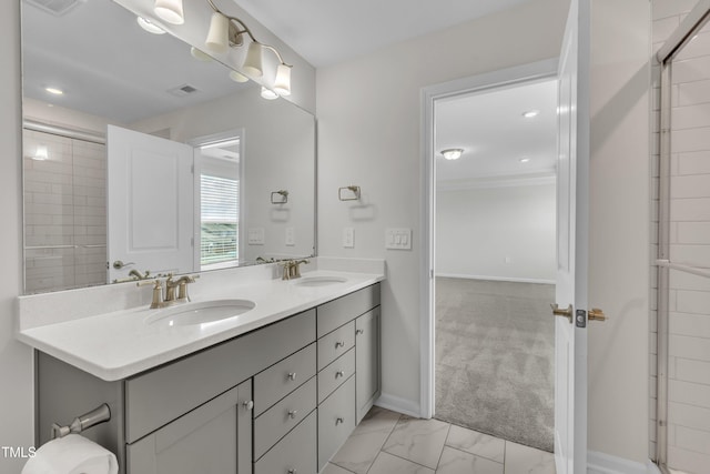 2307 Bethpage Dr, Fuquay Varina, NC 27526 - bathroom featuring double vanity, marble finish floors, crown molding, and recessed lighting