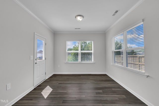 2307 Bethpage Dr, Fuquay Varina, NC 27526 - unfurnished dining area featuring healthy amount of natural light, ornamental molding, and dark wood-style floors