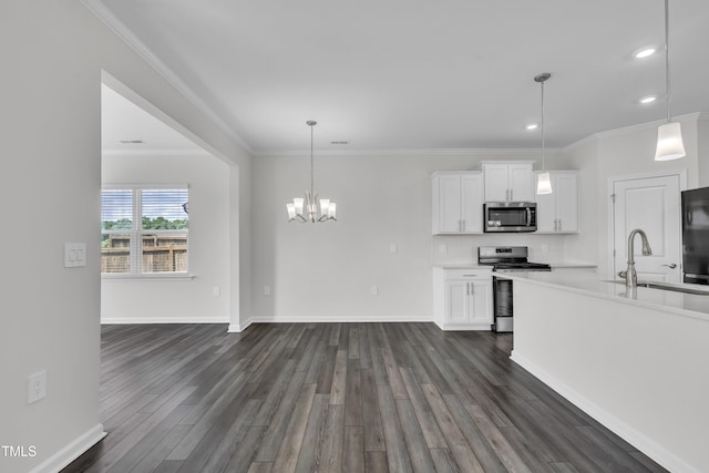 2307 Bethpage Dr, Fuquay Varina, NC 27526 - kitchen featuring stainless steel appliances, dark wood-style flooring, white cabinets, recessed lighting, and light countertops