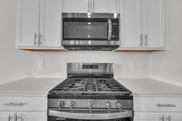 2307 Bethpage Dr, Fuquay Varina, NC 27526 - kitchen with appliances with stainless steel finishes and white cabinetry