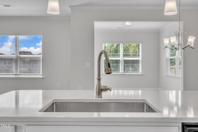 2307 Bethpage Dr, Fuquay Varina, NC 27526 - kitchen with crown molding, light stone counters, white cabinets, and pendant lighting