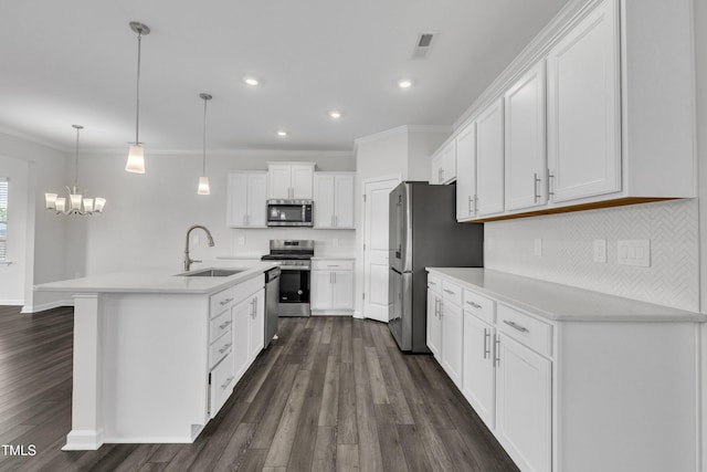 2307 Bethpage Dr, Fuquay Varina, NC 27526 - kitchen with appliances with stainless steel finishes, ornamental molding, white cabinetry, backsplash, and dark wood-style flooring
