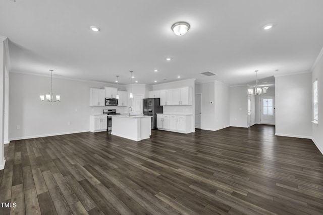2307 Bethpage Dr, Fuquay Varina, NC 27526 - unfurnished living room featuring a chandelier, ornamental molding, dark wood finished floors, and recessed lighting
