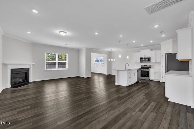 2307 Bethpage Dr, Fuquay Varina, NC 27526 - unfurnished living room with dark wood finished floors, a high end fireplace, recessed lighting, and crown molding