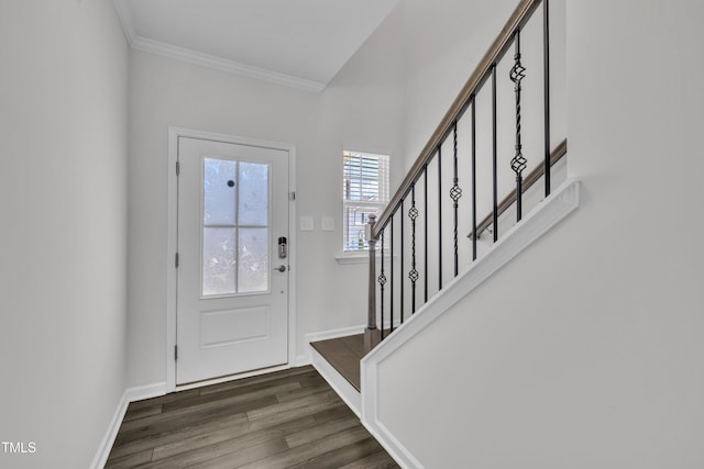 2307 Bethpage Dr, Fuquay Varina, NC 27526 - foyer entrance featuring crown molding, stairs, and dark wood-style flooring