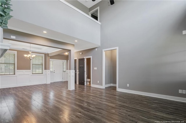 117 Kodiak Cir, Raeford, NC 28376 - unfurnished living room with a chandelier, dark wood finished floors, a ceiling fan, ornamental molding, and recessed lighting