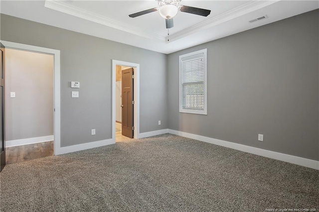 117 Kodiak Cir, Raeford, NC 28376 - unfurnished bedroom featuring ornamental molding, a raised ceiling, carpet flooring, and a ceiling fan