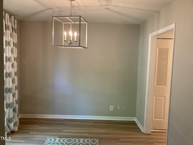 3082 Colony Rd Unit A, Durham, NC 27705 - unfurnished dining area featuring wood finished floors and a chandelier