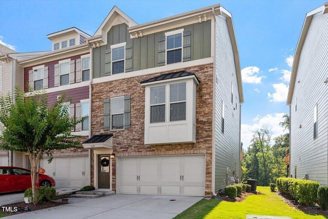 1035 Brownsmith Dr, Apex, NC 27502 - view of property with an attached garage, concrete driveway, stone siding, and board and batten siding