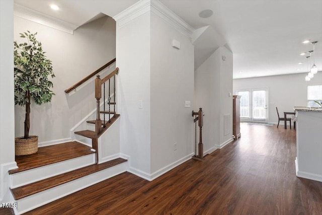 1035 Brownsmith Dr, Apex, NC 27502 - stairs with wood finished floors and recessed lighting