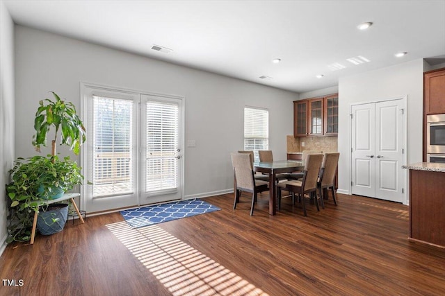 1035 Brownsmith Dr, Apex, NC 27502 - dining area featuring dark wood finished floors and recessed lighting