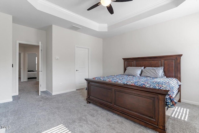 1035 Brownsmith Dr, Apex, NC 27502 - bedroom featuring light colored carpet, a raised ceiling, ornamental molding, and ceiling fan