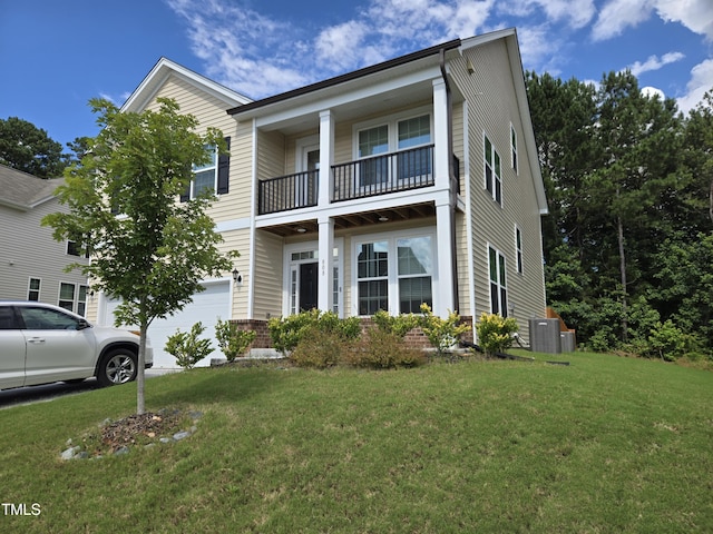 808 Heartpine Dr, Mebane, NC 27302 - view of front facade with a balcony, a front yard, a garage, and brick siding