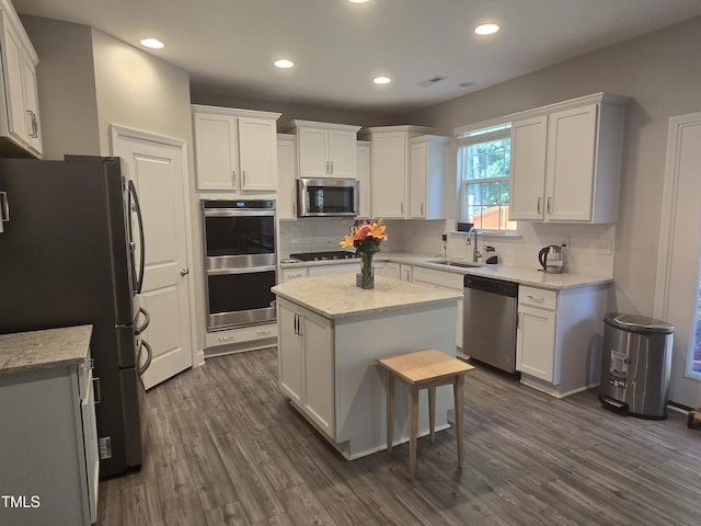 808 Heartpine Dr, Mebane, NC 27302 - kitchen featuring appliances with stainless steel finishes, backsplash, white cabinets, and recessed lighting