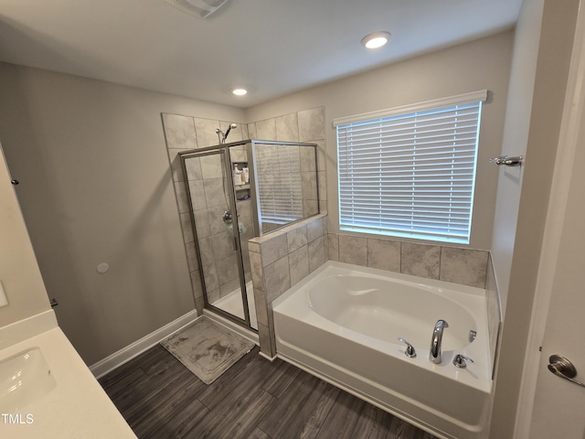 808 Heartpine Dr, Mebane, NC 27302 - full bathroom with a bath, a shower stall, wood finished floors, and recessed lighting