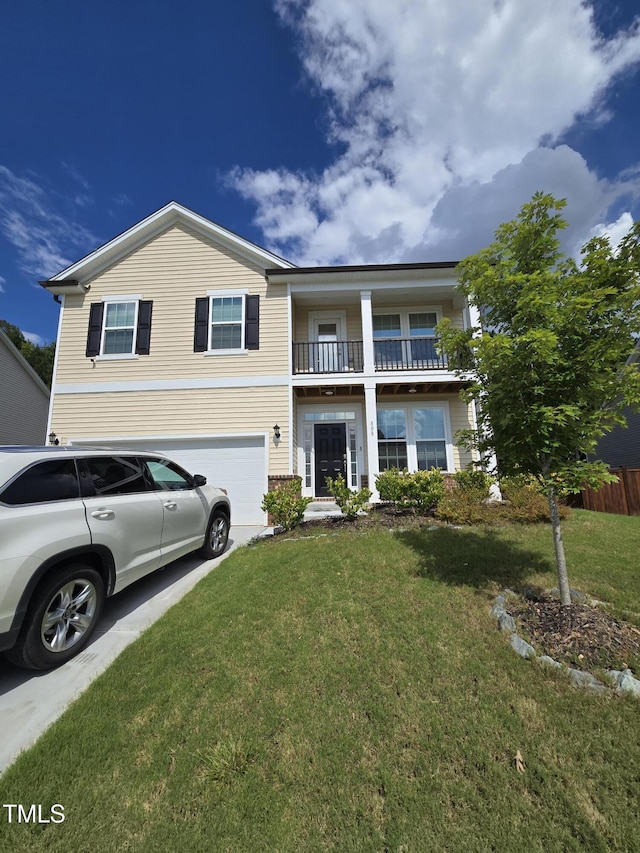 808 Heartpine Dr, Mebane, NC 27302 - view of front of home with a garage, concrete driveway, and a balcony