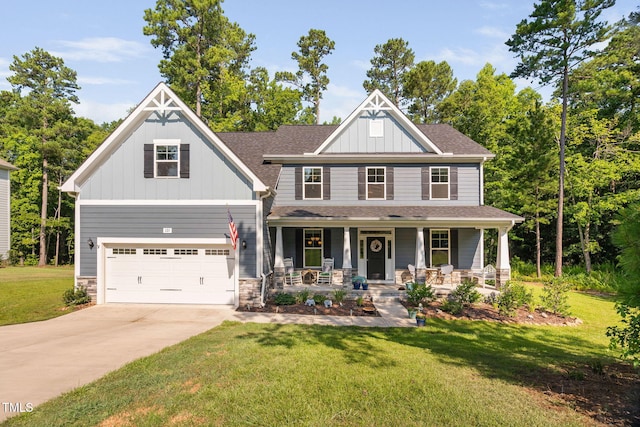 121 Roundrock Ln, Sanford, NC 27330 - craftsman-style house featuring a garage, covered porch, concrete driveway, a front yard, and board and batten siding