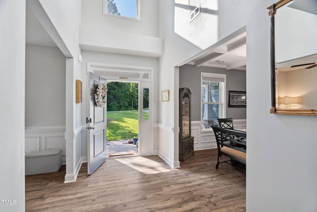 121 Roundrock Ln, Sanford, NC 27330 - entrance foyer featuring healthy amount of natural light, wood finished floors, a decorative wall, coffered ceiling, and beamed ceiling