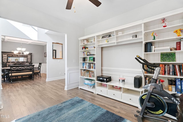 121 Roundrock Ln, Sanford, NC 27330 - living area featuring a chandelier, wood finished floors, and a ceiling fan