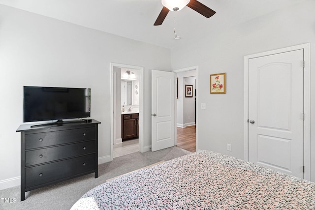 121 Roundrock Ln, Sanford, NC 27330 - bedroom featuring light colored carpet, connected bathroom, and ceiling fan