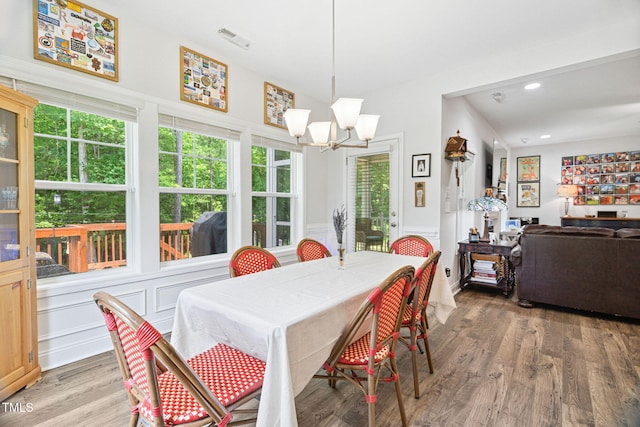121 Roundrock Ln, Sanford, NC 27330 - dining space featuring healthy amount of natural light, wood finished floors, recessed lighting, a wainscoted wall, and a chandelier