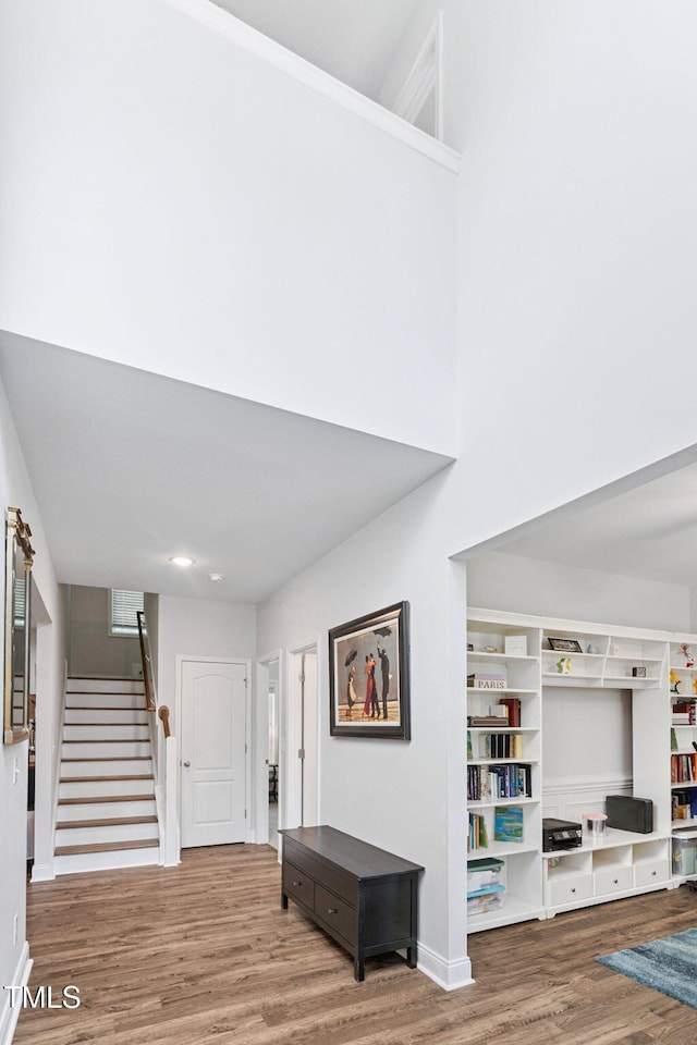 121 Roundrock Ln, Sanford, NC 27330 - foyer entrance featuring wood finished floors, stairs, and a towering ceiling