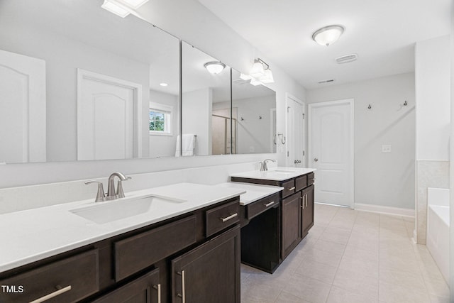 121 Roundrock Ln, Sanford, NC 27330 - full bathroom with vanity, a shower stall, a bath, and tile patterned flooring