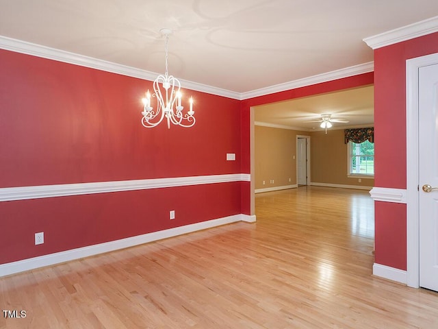6843 Sawyer Rd, Liberty, NC 27298 - unfurnished room featuring light wood-style floors, crown molding, and a chandelier