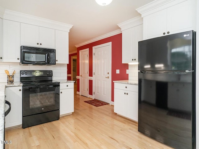 6843 Sawyer Rd, Liberty, NC 27298 - kitchen featuring black appliances, light wood finished floors, backsplash, and crown molding