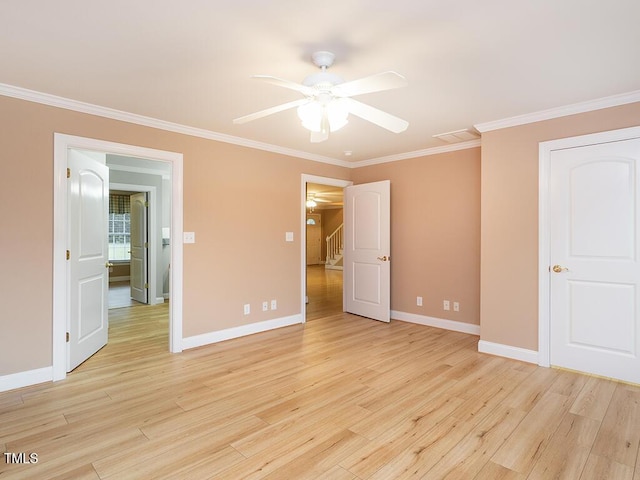 6843 Sawyer Rd, Liberty, NC 27298 - unfurnished bedroom with crown molding, light wood-style flooring, and ceiling fan
