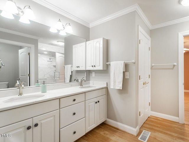 6843 Sawyer Rd, Liberty, NC 27298 - bathroom featuring wood finished floors, walk in shower, double vanity, and crown molding