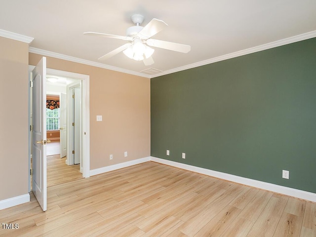 6843 Sawyer Rd, Liberty, NC 27298 - empty room featuring light wood-style flooring, ornamental molding, and a ceiling fan