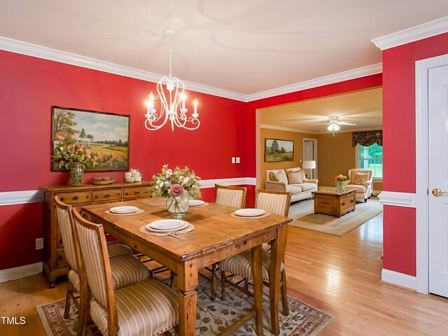6843 Sawyer Rd, Liberty, NC 27298 - dining room with light wood-style floors, crown molding, and a chandelier