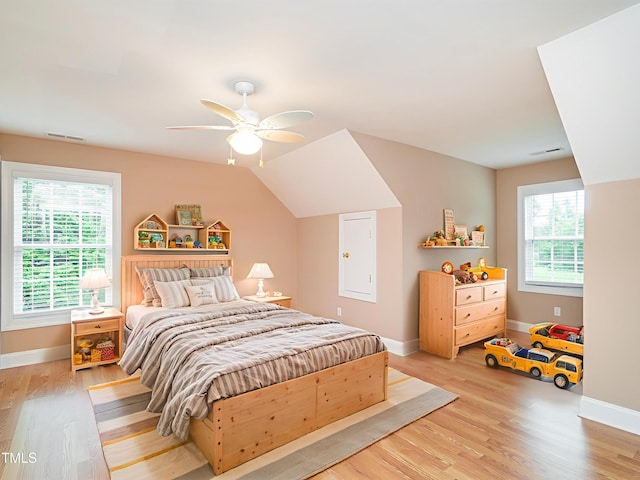 6843 Sawyer Rd, Liberty, NC 27298 - bedroom featuring multiple windows, light wood-style floors, ceiling fan, and lofted ceiling