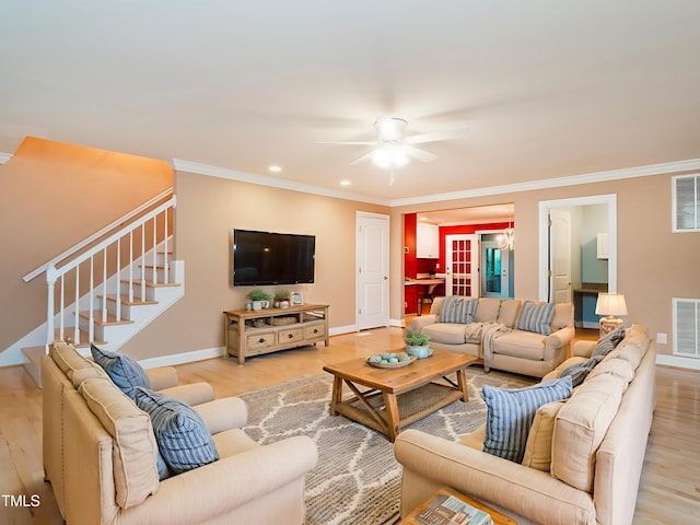 6843 Sawyer Rd, Liberty, NC 27298 - living area with stairway, light wood-type flooring, a ceiling fan, ornamental molding, and recessed lighting