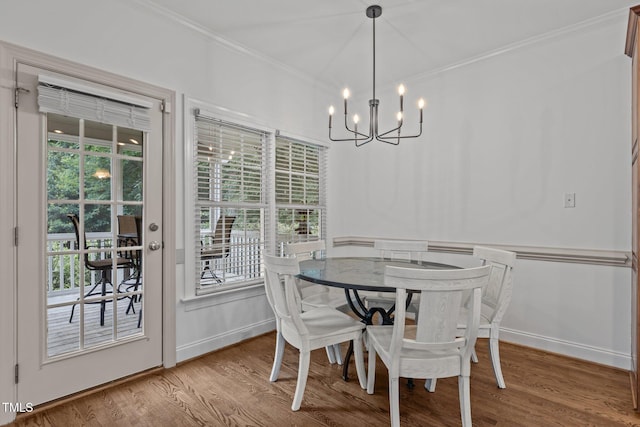 6104 Spicewood Dr, Fuquay Varina, NC 27526 - dining space with a chandelier, ornamental molding, and wood finished floors