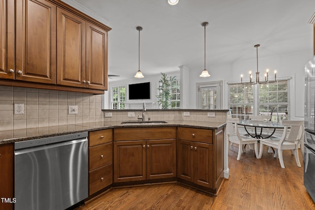 6104 Spicewood Dr, Fuquay Varina, NC 27526 - kitchen with stainless steel dishwasher, a peninsula, decorative backsplash, and dark wood-type flooring