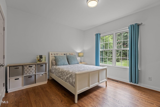 6104 Spicewood Dr, Fuquay Varina, NC 27526 - bedroom featuring wood finished floors and baseboards