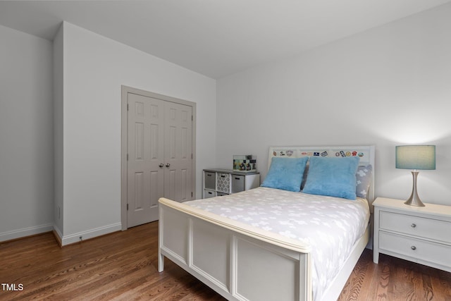 6104 Spicewood Dr, Fuquay Varina, NC 27526 - bedroom featuring wood finished floors and a closet