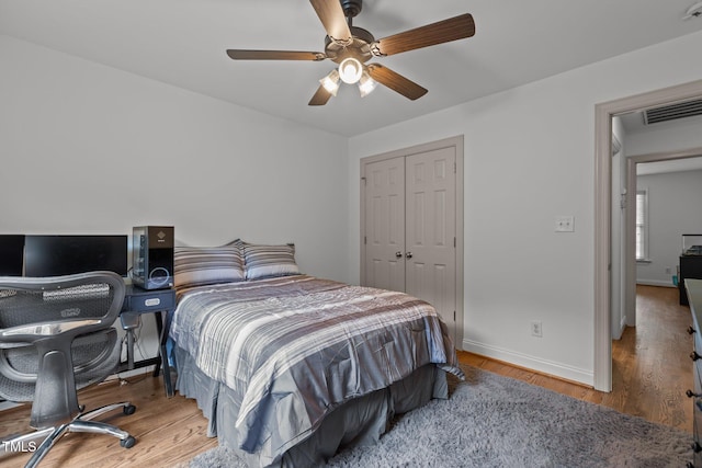 6104 Spicewood Dr, Fuquay Varina, NC 27526 - bedroom with wood finished floors, a closet, and ceiling fan