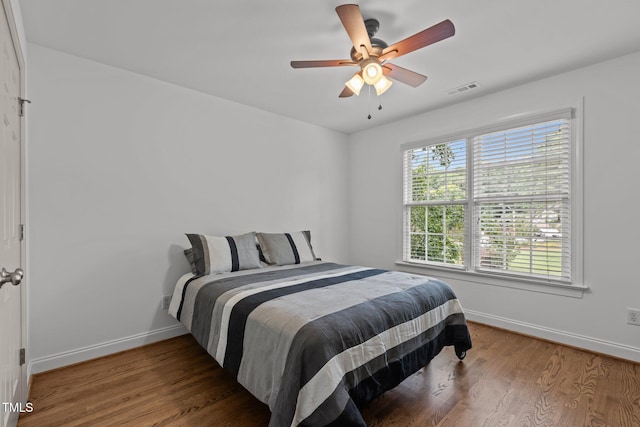 6104 Spicewood Dr, Fuquay Varina, NC 27526 - bedroom with wood finished floors and a ceiling fan