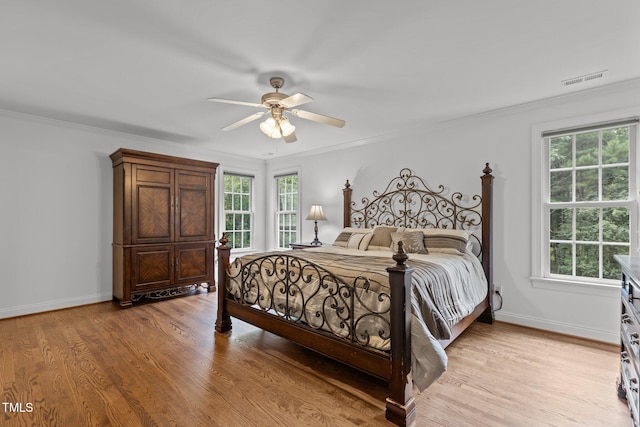 6104 Spicewood Dr, Fuquay Varina, NC 27526 - bedroom featuring light wood-style flooring, crown molding, and ceiling fan