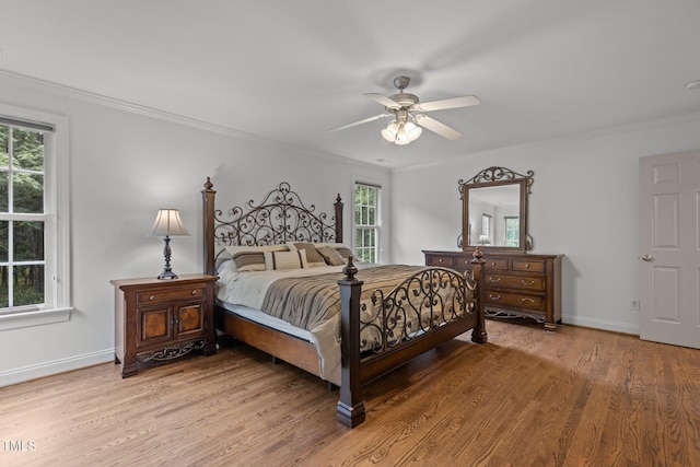 6104 Spicewood Dr, Fuquay Varina, NC 27526 - bedroom with light wood-type flooring, crown molding, and a ceiling fan