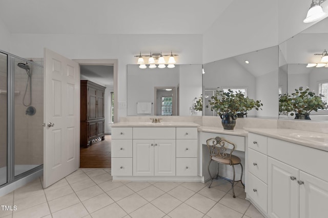6104 Spicewood Dr, Fuquay Varina, NC 27526 - bathroom featuring tile patterned flooring, vanity, a stall shower, and vaulted ceiling