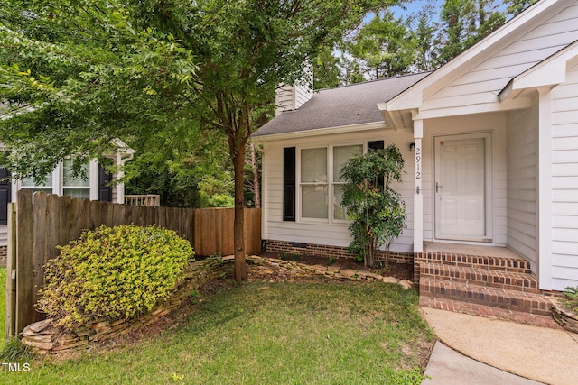 2912 Enson Pl, Raleigh, NC 27603 - view of exterior entry featuring a chimney