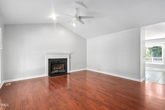 2912 Enson Pl, Raleigh, NC 27603 - unfurnished living room featuring a ceiling fan, hardwood / wood-style floors, a fireplace with flush hearth, and lofted ceiling