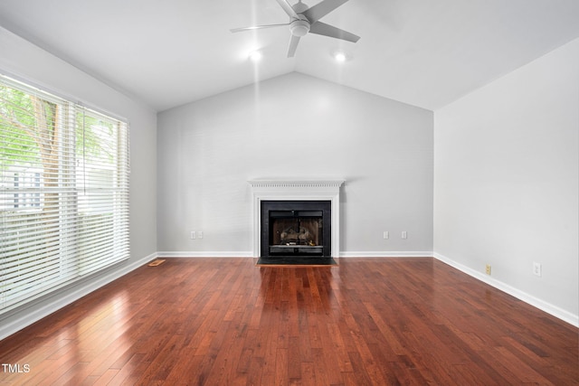 2912 Enson Pl, Raleigh, NC 27603 - unfurnished living room featuring ceiling fan, a fireplace with flush hearth, lofted ceiling, and wood finished floors