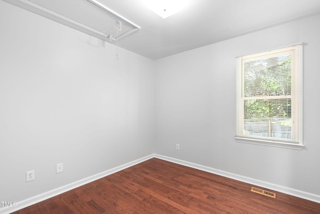 2912 Enson Pl, Raleigh, NC 27603 - spare room with attic access and wood finished floors