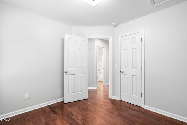 2912 Enson Pl, Raleigh, NC 27603 - unfurnished bedroom with dark wood finished floors