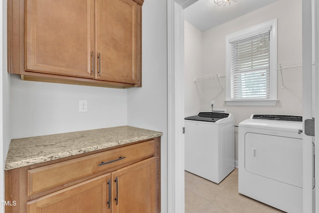 1003 Branwell Dr, Durham, NC 27703 - washroom featuring washing machine and dryer and light tile patterned flooring